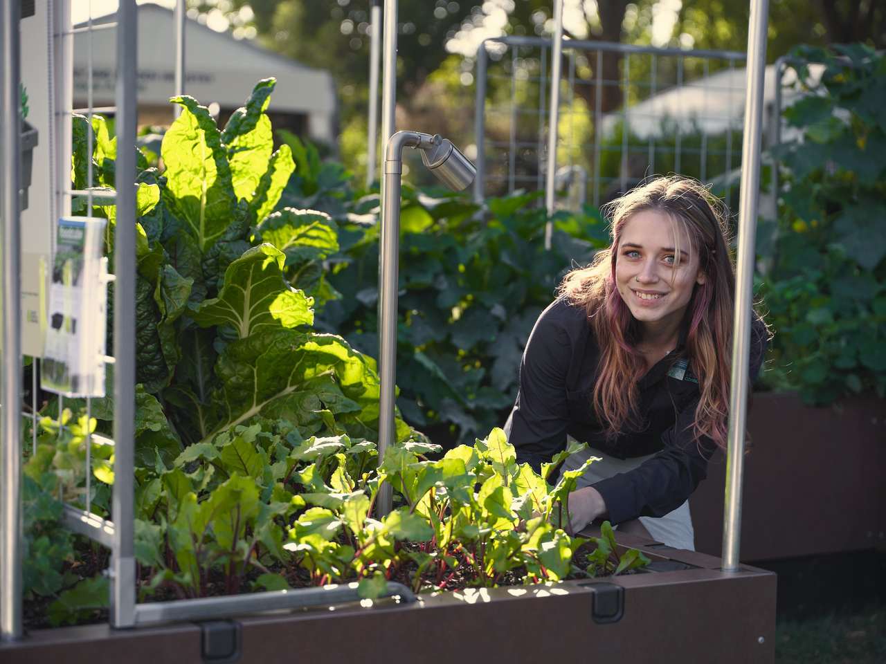Izabella stands in her garden