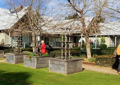 EWHA members and non-members walking around the private garden in Balnarring.