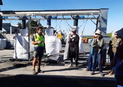 The bags that collect the biochar at the end of a large machine.