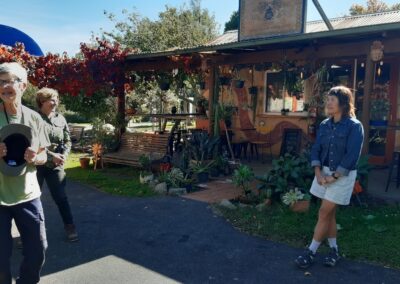 Photo of a few people out the front of a cafe.