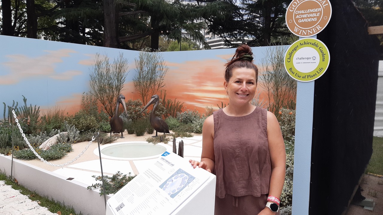 Woman standing in a display garden.