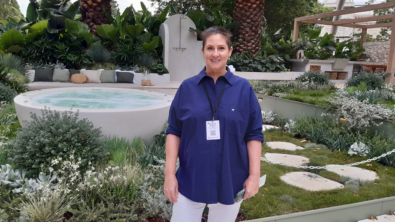 Woman standing in a display garden.