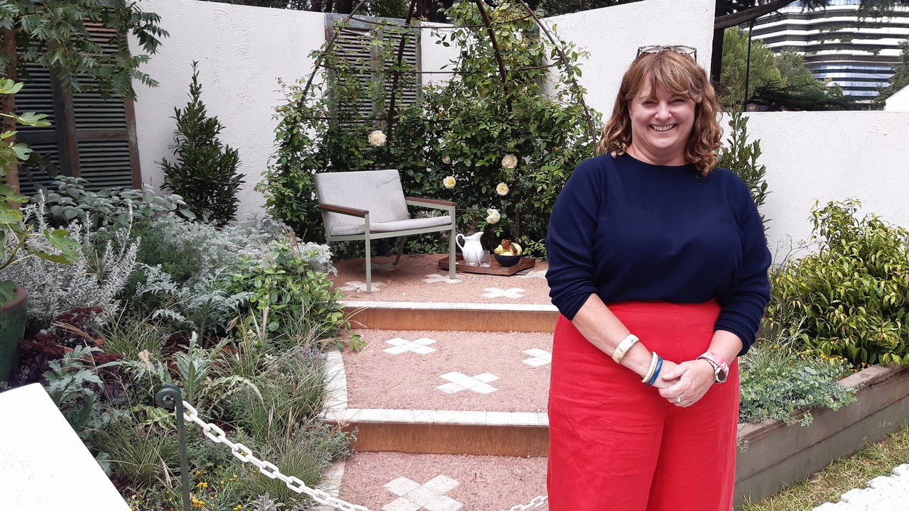 Woman standing in a display garden.